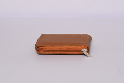 Brown leather wallet with a silver zipper on a white background