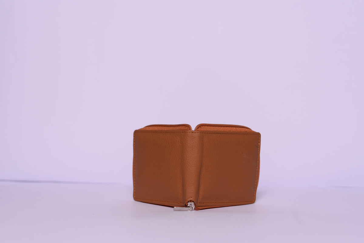 Tan zip-around wallet on a white background